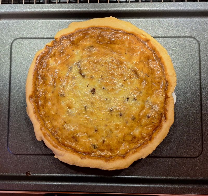 Homemade Quiche Lorraine with a golden cheese, bacon and egg filling